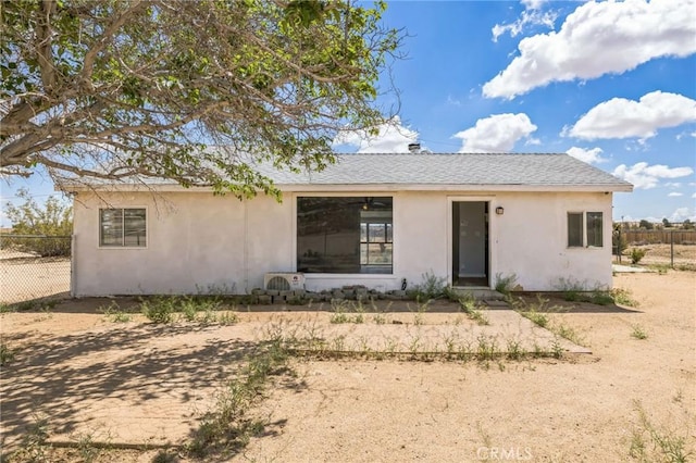 1561 Old Woman Springs Rd, Yucca Valley, CA 92284 - view of front facade with stucco siding and fence