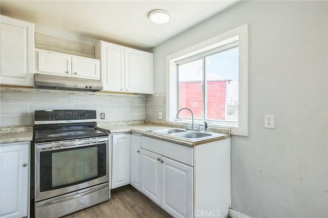 1561 Old Woman Springs Rd, Yucca Valley, CA 92284 - kitchen with stainless steel electric range oven, under cabinet range hood, a sink, white cabinets, and light countertops
