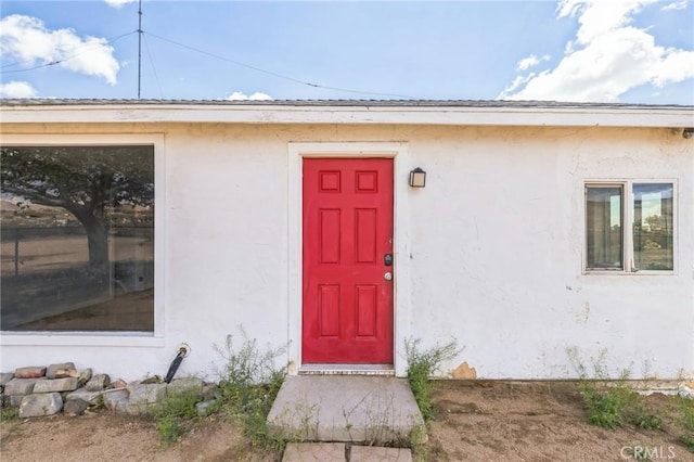 1561 Old Woman Springs Rd, Yucca Valley, CA 92284 - view of exterior entry with stucco siding