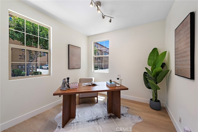 office area featuring wood finished floors and baseboards