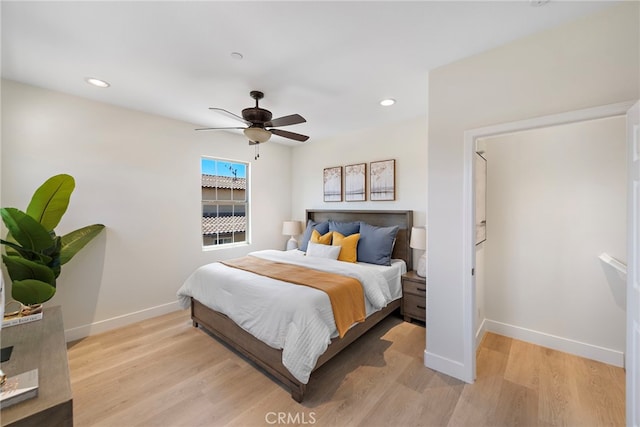 bedroom featuring baseboards, light wood-type flooring, recessed lighting, and a ceiling fan