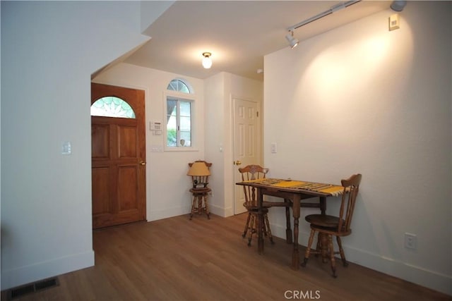 319 Dorn Dr, Crestline, CA 92325 - entrance foyer with baseboards, wood finished floors, and rail lighting