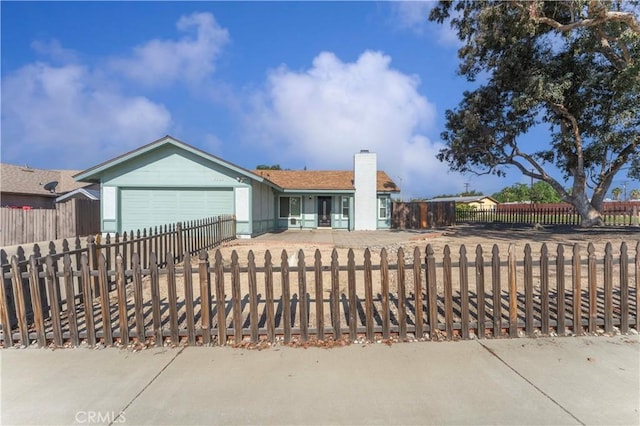 ranch-style home featuring an attached garage, a fenced front yard, and a chimney