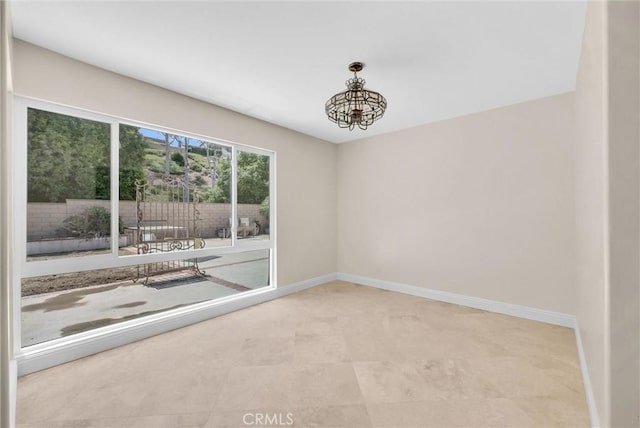 25101 Sebastian Ln, Mission Viejo, CA 92691 - empty room featuring a chandelier and baseboards