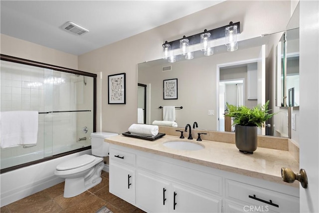 13041 Ranchwood Rd, Tustin, CA 92782 - bathroom featuring toilet, combined bath / shower with glass door, vanity, and tile patterned floors