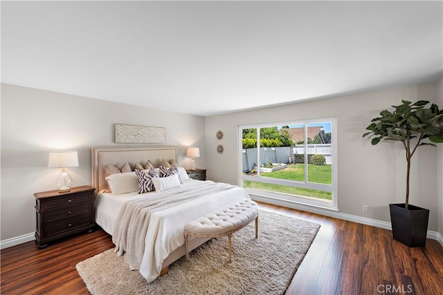 13041 Ranchwood Rd, Tustin, CA 92782 - bedroom with baseboards and dark wood-style floors