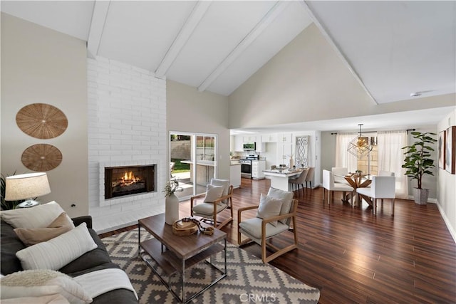 13041 Ranchwood Rd, Tustin, CA 92782 - living room with dark wood-type flooring, a fireplace, high vaulted ceiling, beam ceiling, and a chandelier