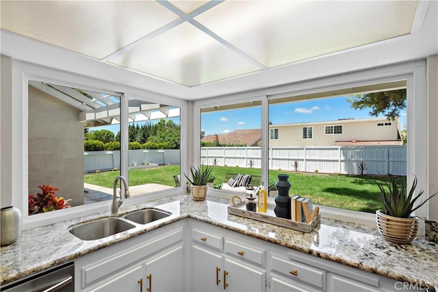 13041 Ranchwood Rd, Tustin, CA 92782 - kitchen with a sink, stainless steel dishwasher, and white cabinetry