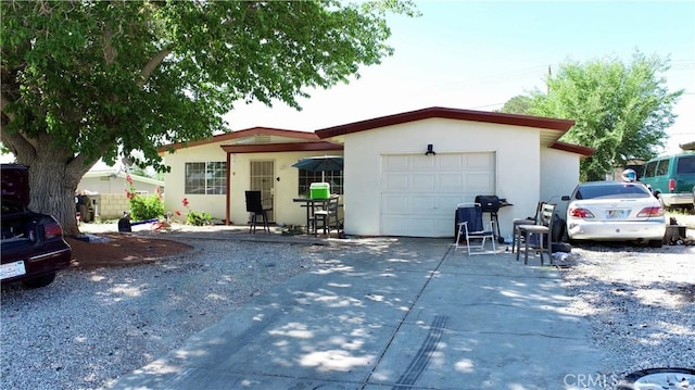 16631 Joshua St, Victorville, CA 92395 - ranch-style home featuring a garage, stucco siding, and driveway