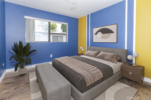 20737 Roscoe Blvd Unit 102, Winnetka, CA 91306 - bedroom featuring baseboards and wood finished floors
