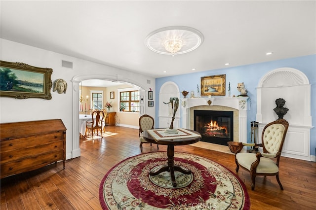 24449 Nan Ct, Diamond Bar, CA 91765 - living room with a fireplace with flush hearth, arched walkways, hardwood / wood-style floors, recessed lighting, and baseboards