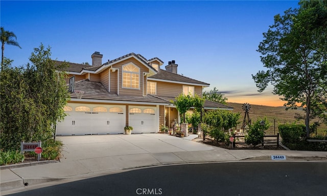 24449 Nan Ct, Diamond Bar, CA 91765 - traditional home with a chimney, driveway, and a tiled roof