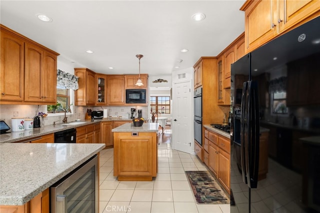 24449 Nan Ct, Diamond Bar, CA 91765 - kitchen featuring wine cooler, black appliances, healthy amount of natural light, a sink, and recessed lighting