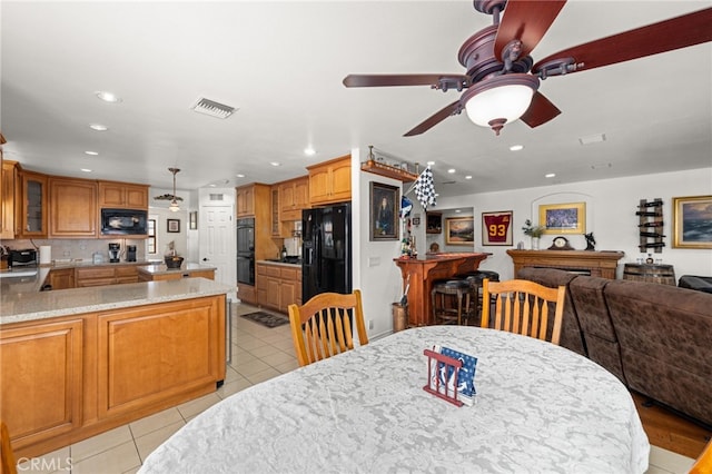24449 Nan Ct, Diamond Bar, CA 91765 - dining space with recessed lighting, light tile patterned floors, ceiling fan, and bar area