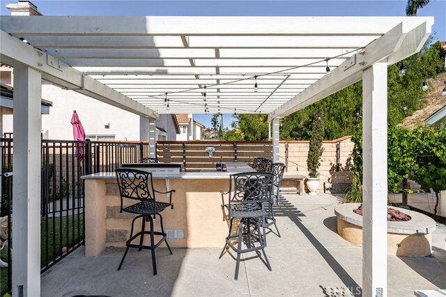 24449 Nan Ct, Diamond Bar, CA 91765 - view of patio featuring a fire pit and a pergola