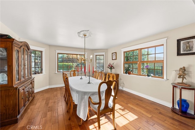 24449 Nan Ct, Diamond Bar, CA 91765 - dining room with light wood-style floors, baseboards, and a chandelier