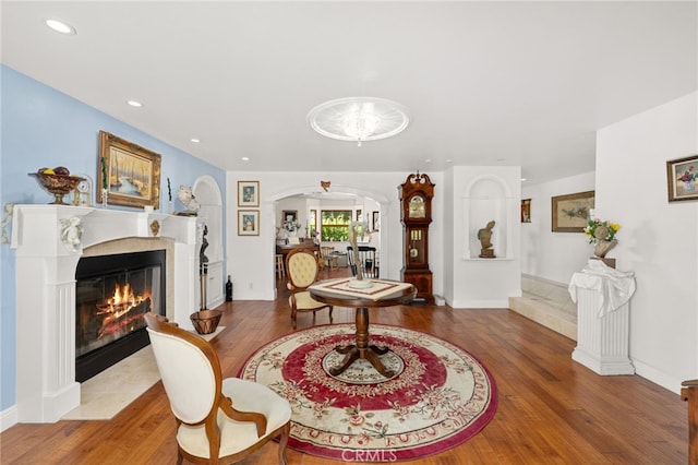 24449 Nan Ct, Diamond Bar, CA 91765 - dining space featuring hardwood / wood-style floors, arched walkways, a fireplace with flush hearth, and recessed lighting