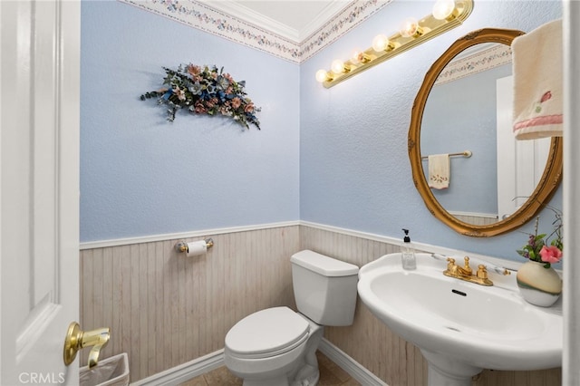 24449 Nan Ct, Diamond Bar, CA 91765 - bathroom featuring a sink, toilet, crown molding, and wainscoting