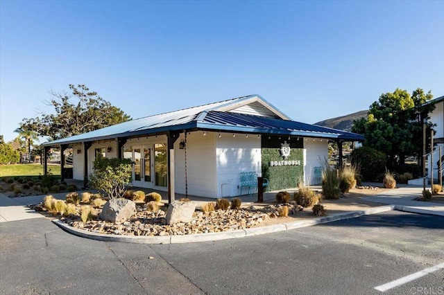 view of home's exterior featuring metal roof