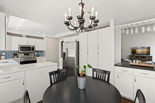 dining room featuring recessed lighting and a chandelier