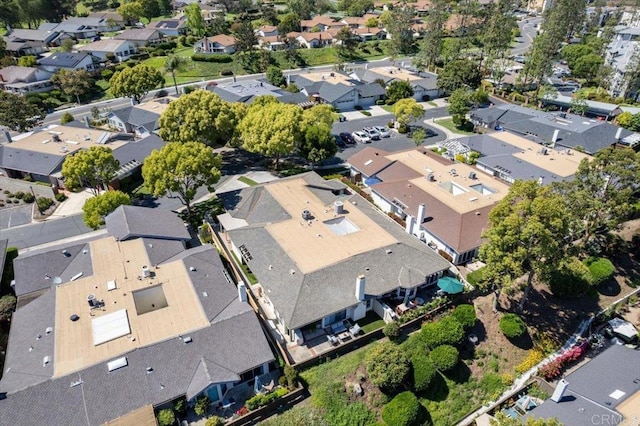 aerial view of property and surrounding area with nearby suburban area