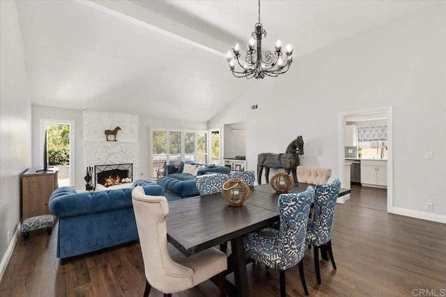 dining space with a chandelier, dark wood-type flooring, plenty of natural light, baseboards, and high vaulted ceiling