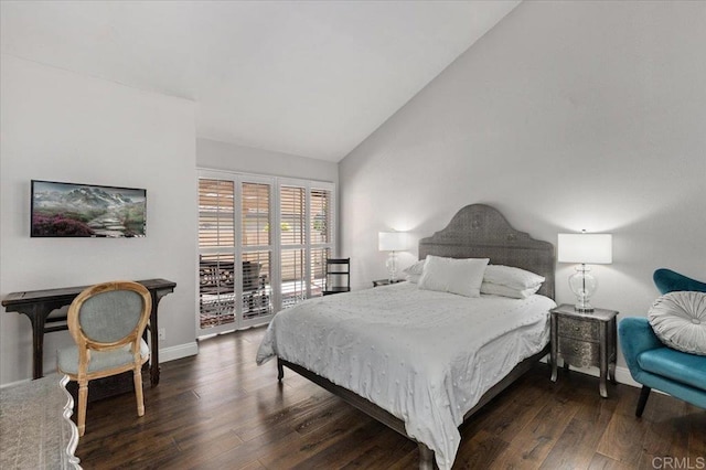 bedroom featuring vaulted ceiling, wood finished floors, access to outside, and baseboards