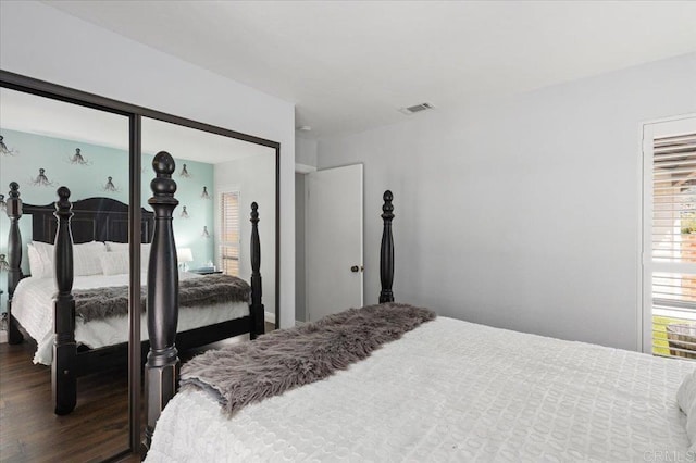 bedroom featuring dark wood-type flooring