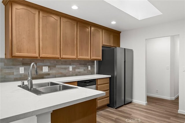 6175 Showdown Cir, Magalia, CA 95954 - kitchen featuring a sink, freestanding refrigerator, light wood-style flooring, decorative backsplash, and recessed lighting