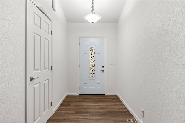 6175 Showdown Cir, Magalia, CA 95954 - doorway with dark wood-style floors and baseboards