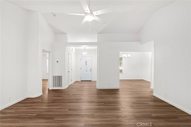 6175 Showdown Cir, Magalia, CA 95954 - unfurnished living room featuring a ceiling fan, dark wood finished floors, a chandelier, baseboards, and vaulted ceiling