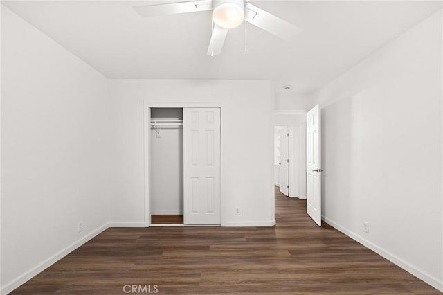6175 Showdown Cir, Magalia, CA 95954 - unfurnished bedroom with wood finished floors, baseboards, a closet, and a ceiling fan