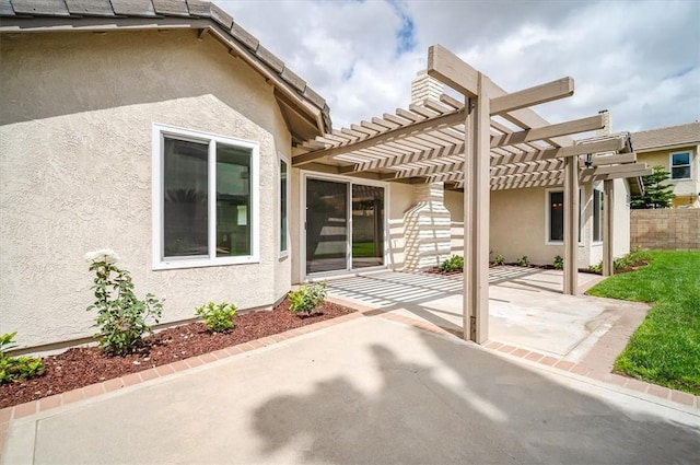 view of patio / terrace with a pergola and fence