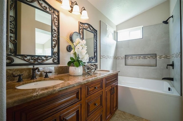 full bathroom featuring lofted ceiling, bathing tub / shower combination, and double vanity