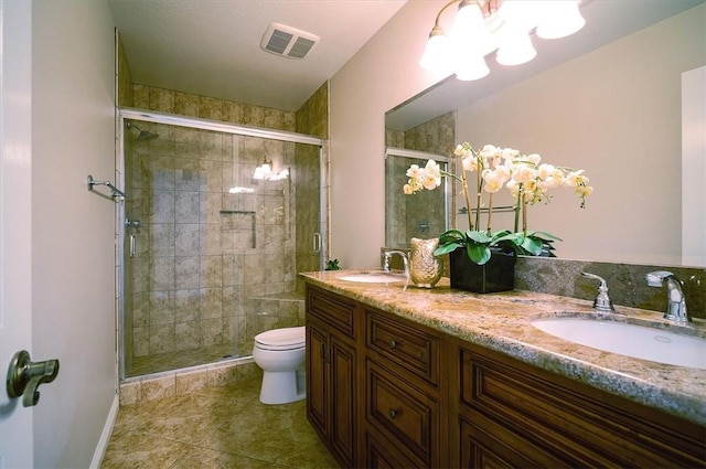 bathroom with a stall shower, toilet, and tile patterned flooring