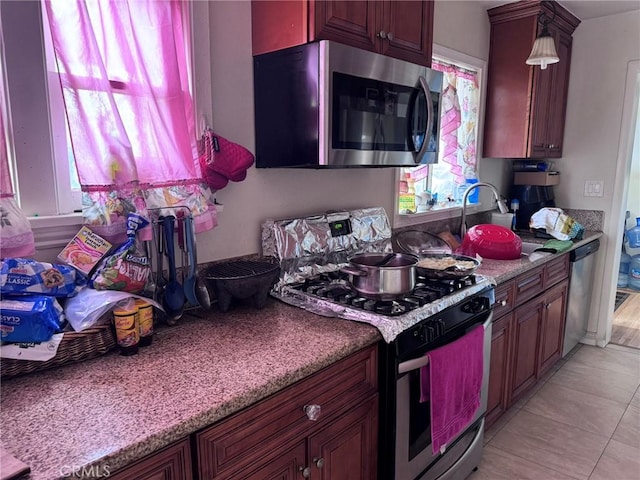 7881 Franklin St, Buena Park, CA 90621 - kitchen with stainless steel appliances, a sink, and light tile patterned flooring