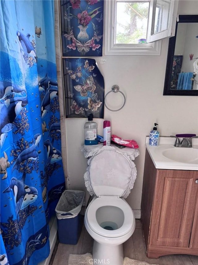 7881 Franklin St, Buena Park, CA 90621 - full bathroom with vanity, tile patterned floors, a shower with shower curtain, and toilet