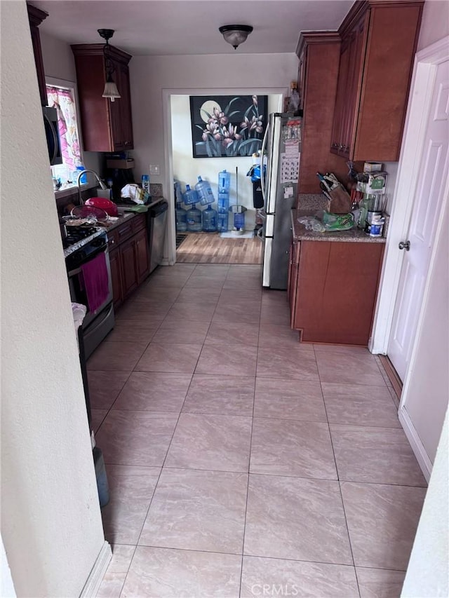 7881 Franklin St, Buena Park, CA 90621 - kitchen featuring stainless steel appliances, a sink, and light tile patterned floors