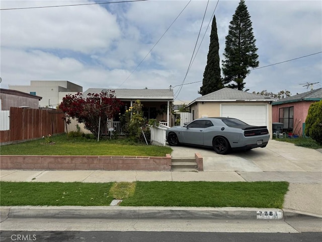 7881 Franklin St, Buena Park, CA 90621 - view of front of property featuring a garage, concrete driveway, and an outbuilding