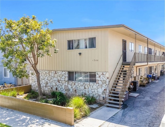 1344 W 225th St, Torrance, CA 90501 - view of front facade featuring stairs, central AC, and stone siding