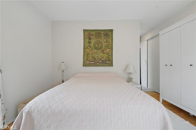 1 Jib St Unit 103, Marina Del Rey, CA 90292 - bedroom with multiple closets and wood finished floors