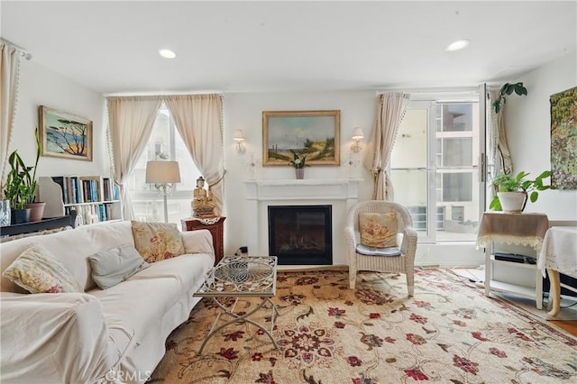 1 Jib St Unit 103, Marina Del Rey, CA 90292 - living area featuring a glass covered fireplace, recessed lighting, and wood finished floors