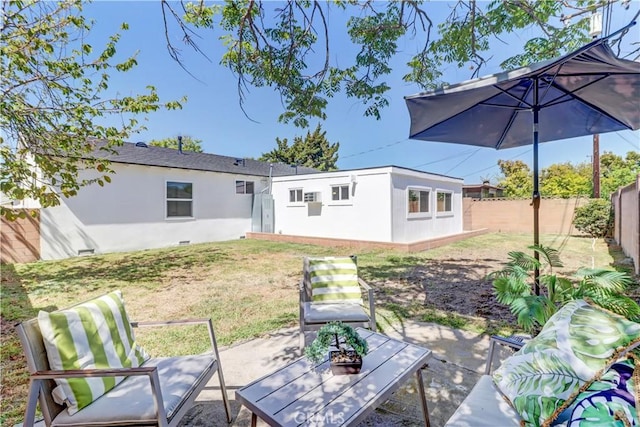 10612 Ketch Ave, Garden Grove, CA 92843 - rear view of property featuring a fenced backyard, stucco siding, a patio, and an outdoor structure