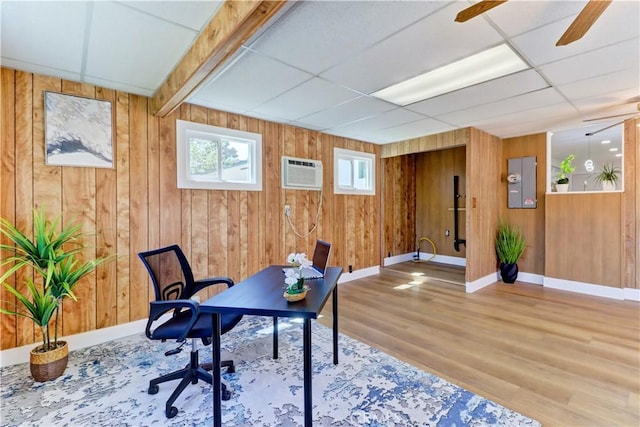 10612 Ketch Ave, Garden Grove, CA 92843 - office with wooden walls, wood finished floors, a drop ceiling, a wall mounted air conditioner, and ceiling fan