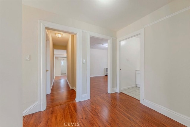 1720 W 25th St, Los Angeles, CA 90018 - corridor featuring wood finished floors and baseboards