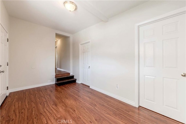 1720 W 25th St, Los Angeles, CA 90018 - unfurnished bedroom with wood finished floors and baseboards