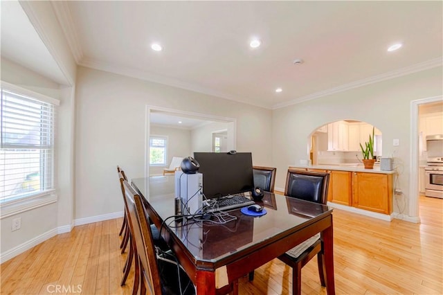 1720 W 25th St, Los Angeles, CA 90018 - dining room with light wood-style flooring, arched walkways, ornamental molding, baseboards, and recessed lighting