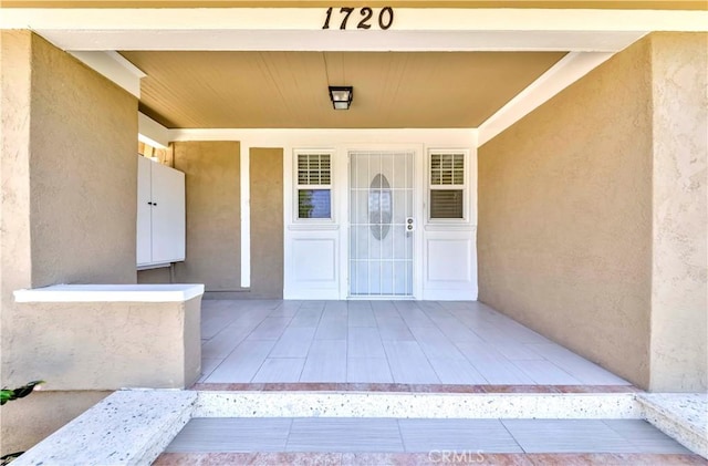 1720 W 25th St, Los Angeles, CA 90018 - property entrance featuring stucco siding