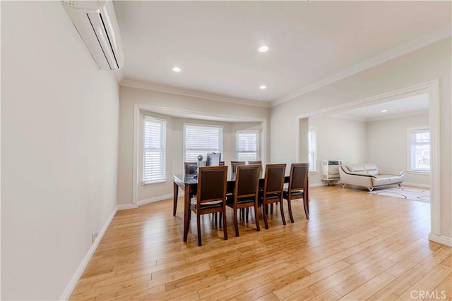 1720 W 25th St, Los Angeles, CA 90018 - dining space featuring an AC wall unit, light wood-style flooring, baseboards, crown molding, and recessed lighting