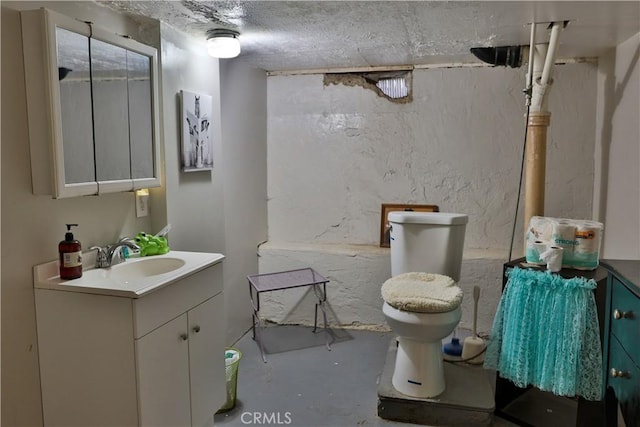 1201 S St, Corning, CA 96021 - bathroom featuring vanity, finished concrete flooring, and toilet